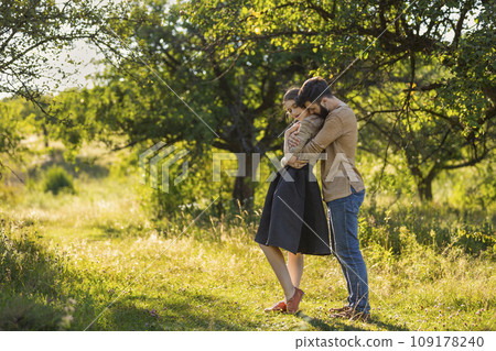 young couple hugging in nature 109178240