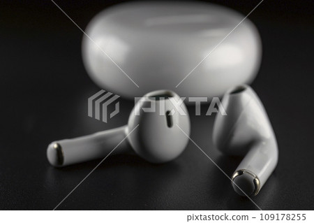 ROSTOV-ON-DON, RUSSIA - APRIL 28, 2018: Apple AirPods wireless Bluetooth headphones and charging case for Apple iPhone. New Apple Earpods Airpods in box. 109178255