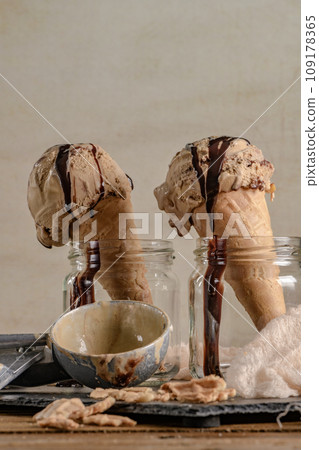 Chocolate ice cream in waffle cones 109178365