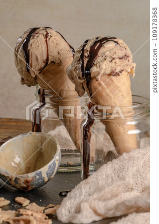 Chocolate ice cream in waffle cones 109178368
