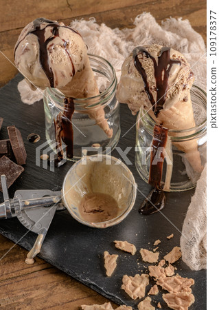 Chocolate ice cream in waffle cones 109178377