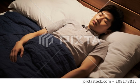 Young Japanese man sleeping in bed 109178815