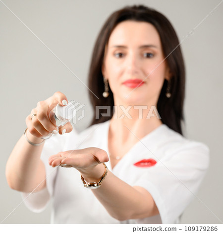 The girl holds a skin care cream in her hands The girl holds a skin care cream in her hands 109179286