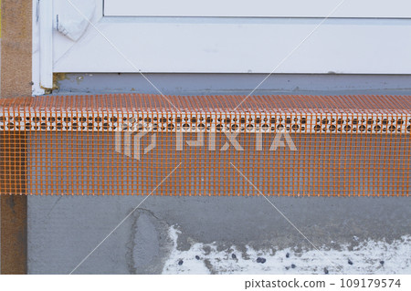 Fiberglass corner reinforcement mesh on Windows Fiberglass corner reinforcement mesh on Windows 109179574
