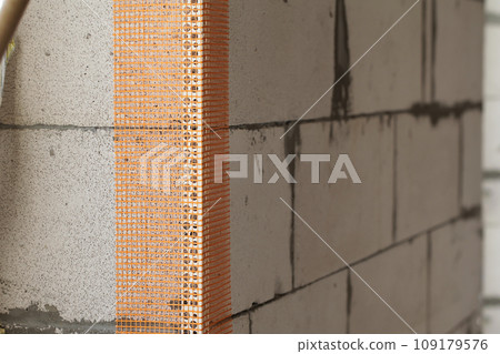 Corner fiberglass reinforcement mesh on wall Corner fiberglass reinforcement mesh on wall 109179576