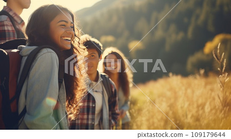Cheerful group of friends with backpacks for hike walking through forest exploring nature in summer Cheerful group of friends with backpacks for hike walking through forest exploring nature in summer 109179644