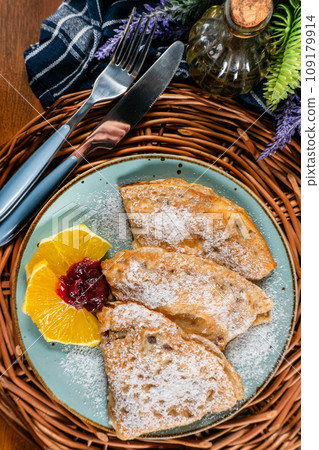 Pancakes stuffed with cheese . 109179914