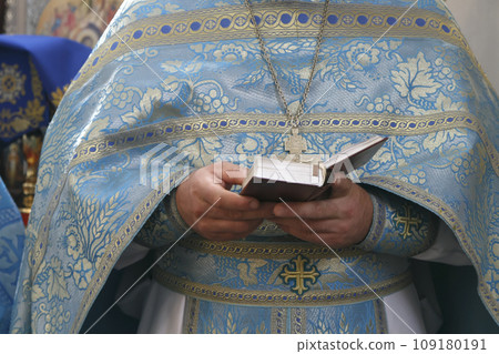 Orthodox priest with Bible 109180191