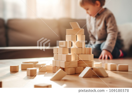 Cute little child playing with wooden blocks. Sustainable eco friendly toys Cute little child playing with wooden blocks. Sustainable eco friendly toys 109180378