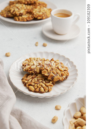 A heap of Portugues traditional peanut cookies known as Bolachas de Amendoim on the white plate 109182309