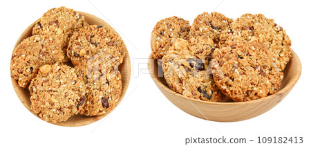 Granola cookie in wooden bowl isolated on white background with full depth of field. Top view. Flat lay. Granola cookie in wooden bowl isolated on white background with full depth of field. Top view. Flat lay. 109182413