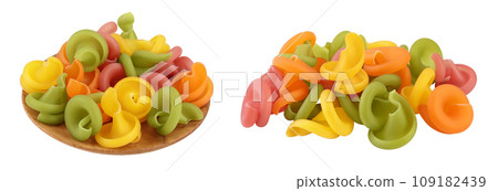 Raw colored pasta in wooden bowl isolated on white background with full depth of field Raw colored pasta in wooden bowl isolated on white background with full depth of field 109182439