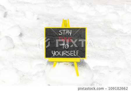 Stay true to yourself symbol. Concept word Stay true to yourself on beautiful black chalk blackboard. Beautiful white snow background. Business stay true to yourself concept. Copy space 109182662