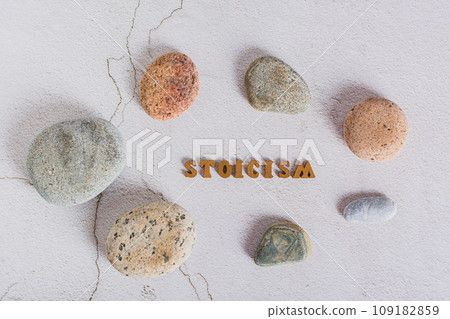 Concept stoicism word made from letters and stones around on a gray background top view Concept stoicism word made from letters and stones around on a gray background top view 109182859
