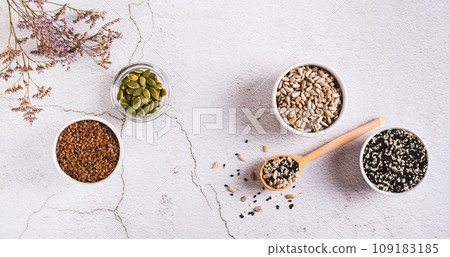 Pumpkin, flax, sesame and sunflover seeds cycling for hormone balance top view web banner Pumpkin, flax, sesame and sunflover seeds cycling for hormone balance top view web banner 109183185