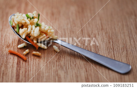 Puffed with hot spices and Bombay mix 109183251