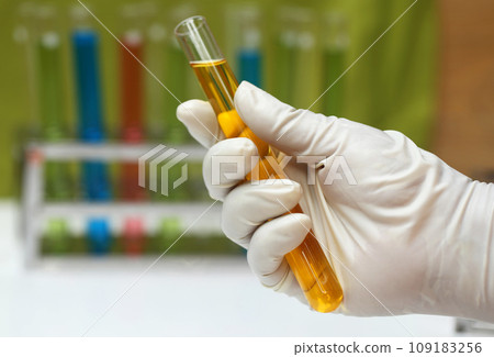 Hand holding a test tube Hand holding a test tube 109183256