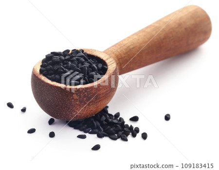 Nigella seeds in wooden scoop 109183415