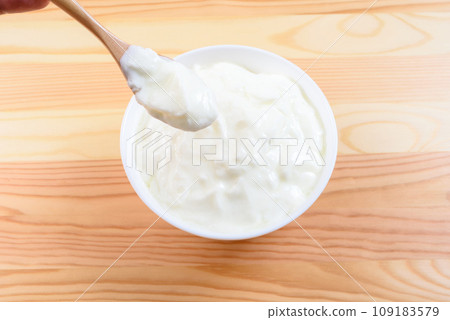 Yogurt in a white plate on the table breakfast health food 109183579