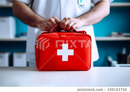 Doctor holding the red ,first aid medical kit bag with white cross. Doctor holding the red ,first aid medical kit bag with white cross. 109183788