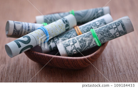 Rolled US Dollar as food product 109184433