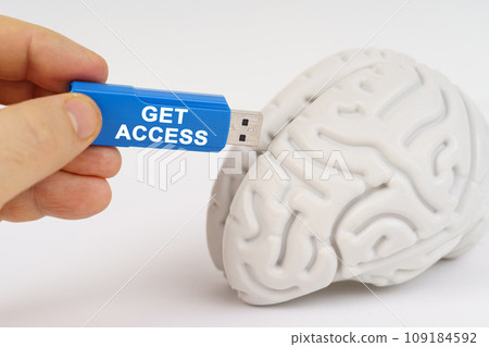 A man inserts a flash drive into his brain with the inscription - Get Access 109184592