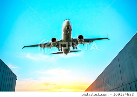 Passenger jet plane flies in the sky. Air transport industry Passenger jet plane flies in the sky. Air transport industry 109184688