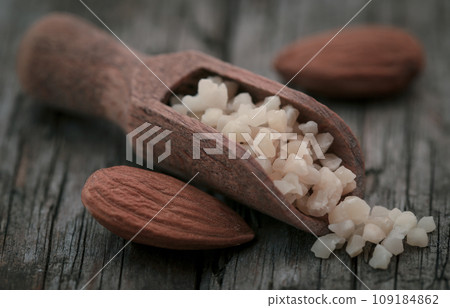 Small pieces of chopped almonds with whole ones 109184862