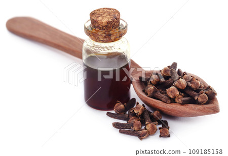 Fresh clove with oil in a jar Fresh clove with oil in a jar 109185158