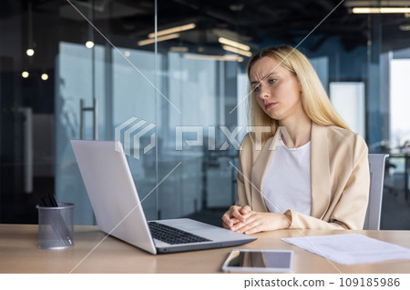 Frustrated sad upset woman working inside office, business woman got bad achievement result, female worker unhappy reading data from laptop screen. Frustrated sad upset woman working inside office, business woman got bad achievement result, female worker unhappy reading data from laptop screen. 109185986