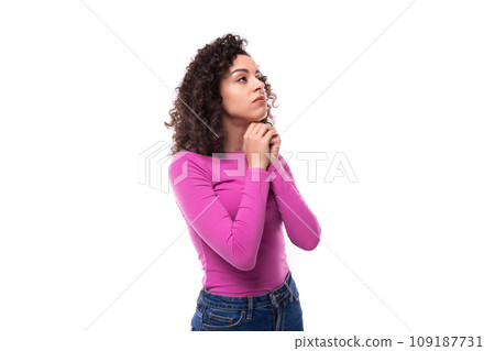 young leader woman with curly black hair wearing a lilac sweater brainstorming to generate ideas 109187731