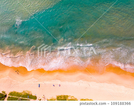 Aerial view of Waves crashing on sandy shore,Sea surface ocean waves background,Top view beach background 109188366