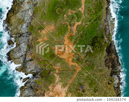 Bird eye view seashore with big wave crashing on rock cliff. Beautiful waves sea surface in sunny day summer background, Amazing seascape top view seacoast landscape view 109188374