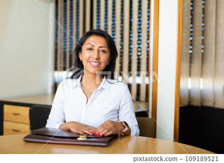 Young adult woman working in meeting room Young adult woman working in meeting room 109189521