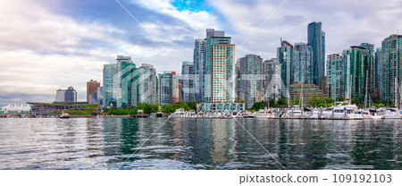 Residential Home Buildings in Modern City. Sunny Blue Sky Day. 109192103