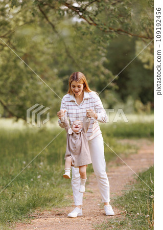 A joyful image of a mother and child in a park 109192456