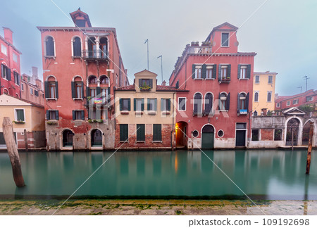 Traditional Venetian houses along the canal on a sunny day. Traditional Venetian houses along the canal on a sunny day. 109192698