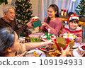 Happy asian people are celebrating on a table meal when christmas and new year at home. 109194933