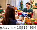 Happy asian people are celebrating on a table meal when christmas and new year at home. 109194934