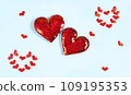 Abstract two red hearts on Blue background with small hearts 109195353