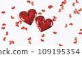Two big red hearts surrounded by many small hearts on a white background 109195354