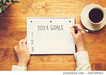 2024 goals with a person holding a pen 2024 goals with a person holding a pen 109196401