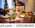 Beautiful dinner for new year and christmas tree decoration background. 109196409