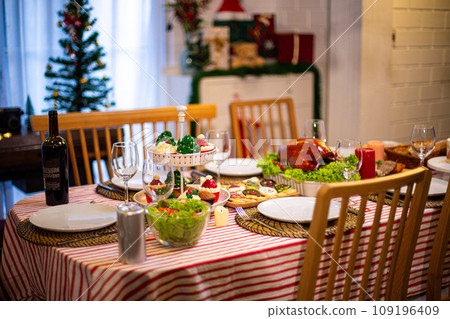Beautiful dinner for new year and christmas tree decoration background. 109196409