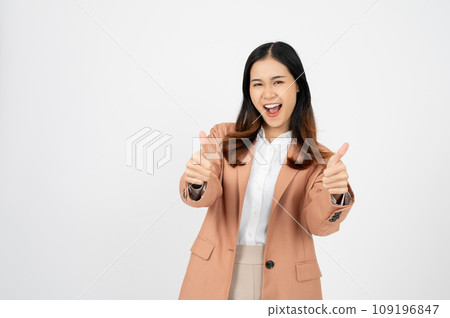 Confident asian woman showing thumb up in approval, recommending, standing over white background 109196847
