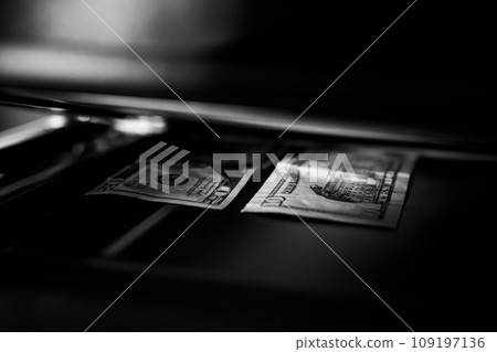 Using a copy machine to print forgery currency. Using a copy machine to print forgery currency. 109197136
