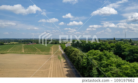 Rural Contrast: Fields and Wind Turbines 109197662