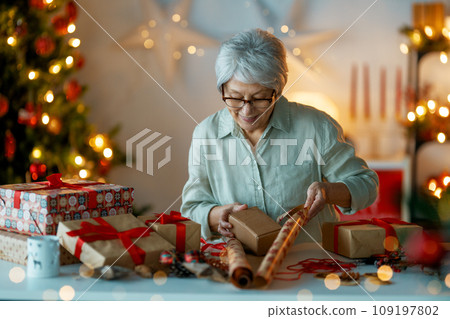 woman preparing  presents woman preparing  presents 109197802