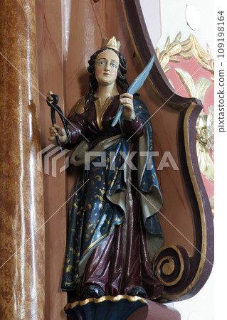 Saint Apollonia statue on the altar in Parish Church of Saint Martin in Martinska Ves, Croatia 109198164