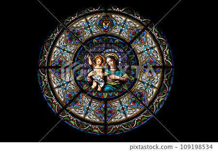 Virgin Mary with baby Jesus, stained glass window in the Cathedral of Saint Lawrence in Lugano, Switzerland 109198534